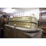 VICTORIAN CUT BRASS SMALL FIRE FENDER AND A LARGE CIRCULAR COPPER TRAY WITH RAISED BORDER (2)