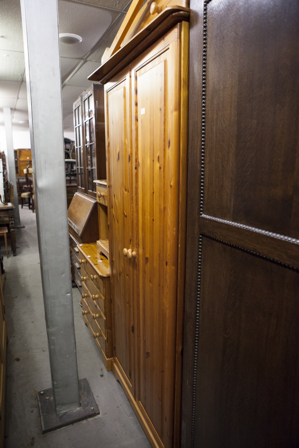 A FOUR PIECE PINE MODERN BEDROOM SUITE TO INCLUDE; TWO DOUBLE WARDROBES, ONE OVER DRAWER, BEDSIDE