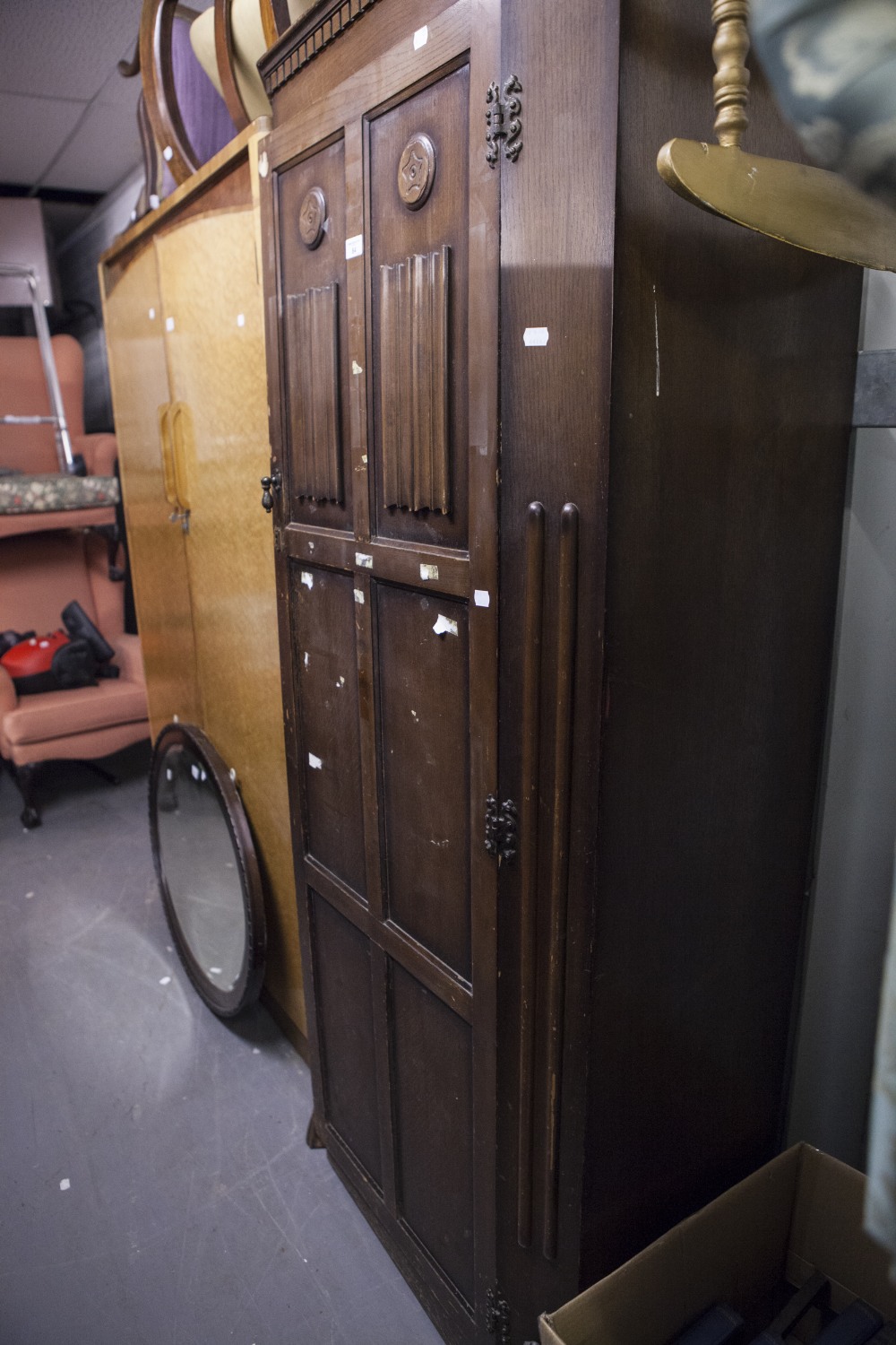 A MID TWENTIETH CENTURY DARK OAK HALLROBE, DENTIL CORNICE, OVER CANTED CORNERS, THE PANELLED DOORS - Image 2 of 2