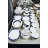 TUSCAN CHINA TEA AND DESSERT SERVICE WITH BLUE AND GILT BORDERS FOR 12 PERSONS, 68 PIECES (SOME A.