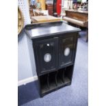 AN EDWARDIAN AESTHETIC MOVEMENT EBONISED MUSIC CABINET WITH INCISED GILT DECORATION, TWO DOORS