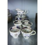 SIX EARLY VICTORIAN CHINA TEA CUPS AND SAUCER AND A MILK JUG WITH PRINTED AND COLOURED FLORAL