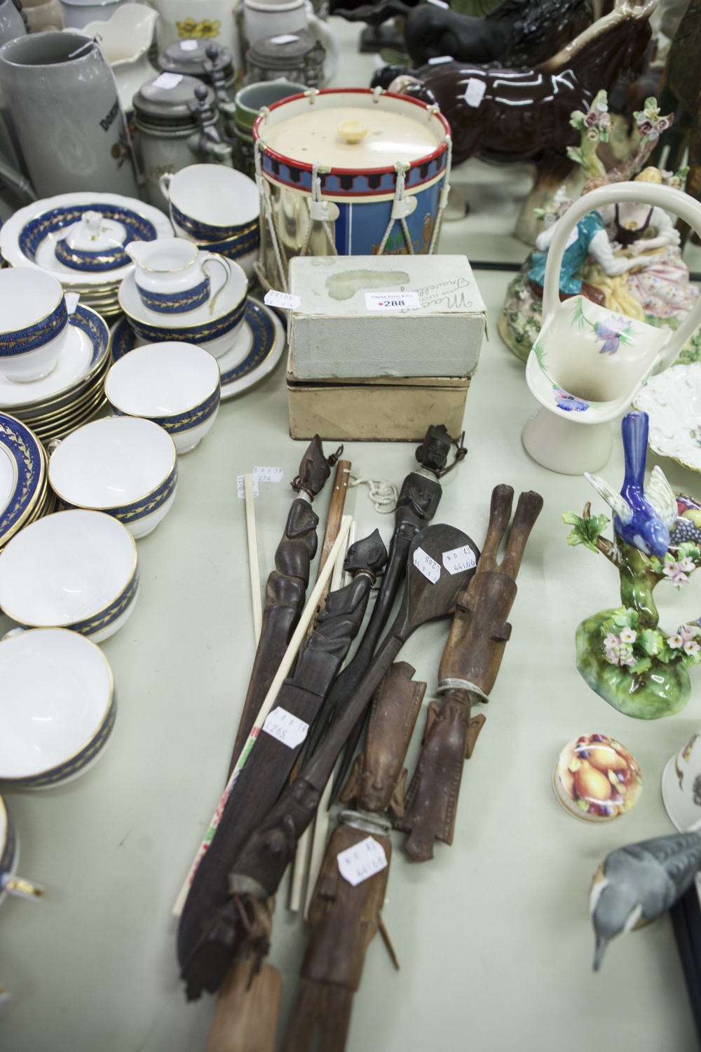 TWO SMALL TRAVEL IRONS, BOXED, AN AFRICAN CARVED WOOD SERVING SPOON, CUTLERY, A PAIR OF CHOPSTICKS