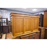 A MODERN MAHOGANY CHIFFONIERE, WITH TWO PIANO FRONTED FRIEZE DRAWERS OVER THREE DOORS, 4'6" WIDE