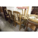 AN OAK DRAW-LEAF DINING TABLE AND SIX MATCHING CHAIRS (4 + 2)