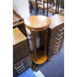 A MAHOGANY CIRCULAR JARDINIERE STAND, TWO TIER WITH THREE BOBBIN TURNED LEGS