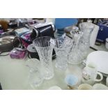 A COLLECTION OF CUT GLASS WARES, TO INCLUDE; FOUR VASES AND A DECANTER WITH A STOPPER (5)