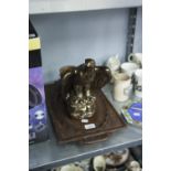 A GILT PLASTER MODEL OF AN HERALDIC EAGLE, AN AUSTRIAN LEAF CARVED AND PIERCE TWO HANDLED OVAL