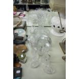 A LARGE CUT GLASS FRUIT BOWL, A CUT GLASS BASKET PATTERN BOWL, A TAPERING LARGE FLOWER VASE ETC.....