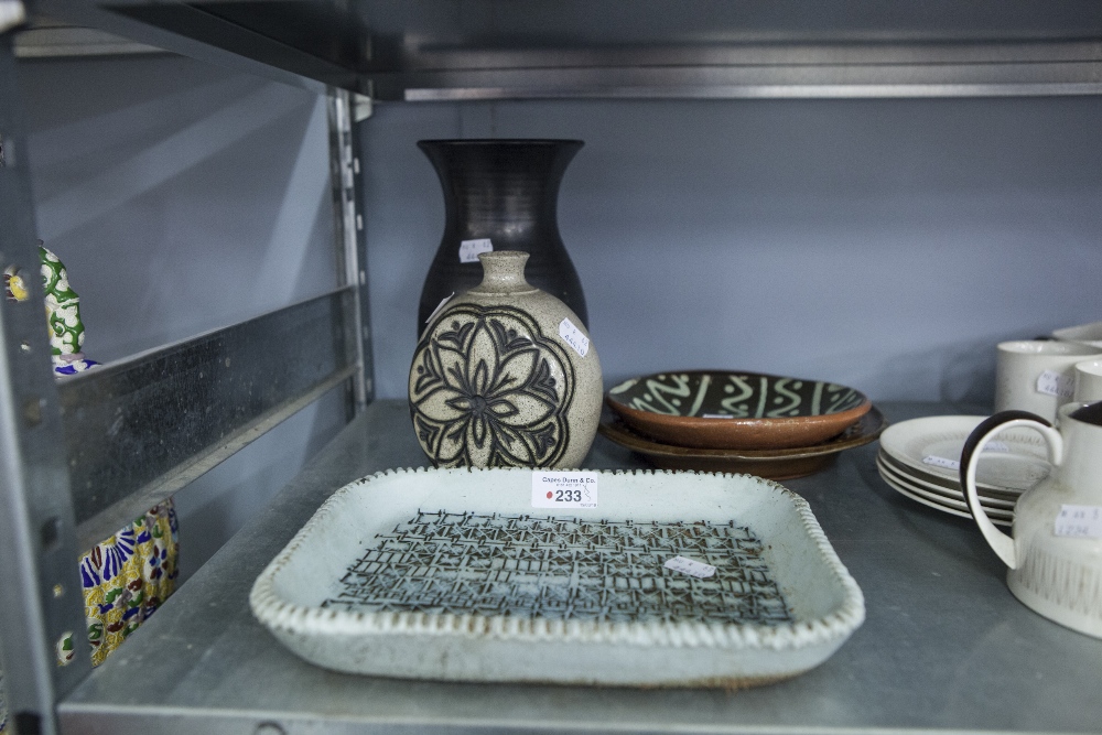 PRINKNASH BLACK POTTERY VASE, THREE PIECES OF SLIP WARE AND A STUDIO POTTERY VASE WITH INCISED