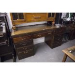 A TWENTIETH CENTURY MAHOGANY DOUBLE PEDESTAL DESK WITH NINE DRAWERS, ON PLINTH BASES, 5;6" X 1'8"