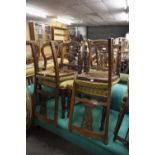 SET OF FOUR LATE VICTORIAN CARVED WALNUTWOOD DINING CHAIRS WITH PIERCED SPLAT BACKS AND STUFF OVER
