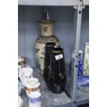 A LARGE ORIENTAL POTTERY VASE AND TWO BLACK AND GILT DECORATED GLASS VASES (3)