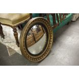 LARGE REGENCY STYLE CARVED WALL MIRROR, THE GILT FRAME WITH BALL ORNAMENT AND EBONISED INNER SLIP