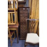 POSSIBLY SOUTH AFRICAN DESIGN MODERN TALL NARROW PEDESTAL OF ELEVEN SMALL DRAWERS WITH KNOB HANDLES