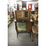 CIRCA 1960's TELEVISION SET, A WALNUTWOOD CASE WITH TAMBOUR SHUTTER AND AN OLD BUSH VALVE RADIO