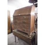 AN EARLY TWENTIETH CENTURY MAHOGANY BUREAU, FALL FRONT OVER FOUR GRADUATED DRAWERS (A.F.)