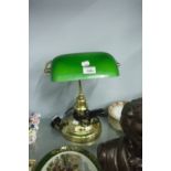 BRASS DESK LAMP WITH GREEN OPAQUE GLASS AND ADJUSTABLE OBLONG SHADE AND A DOMED CIRCULAR BASE