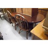 A REPRODUCTION MAHOGANY EXTENDING DINING TABLE AND FOUR SIMILAR DINING CHAIRS (5)