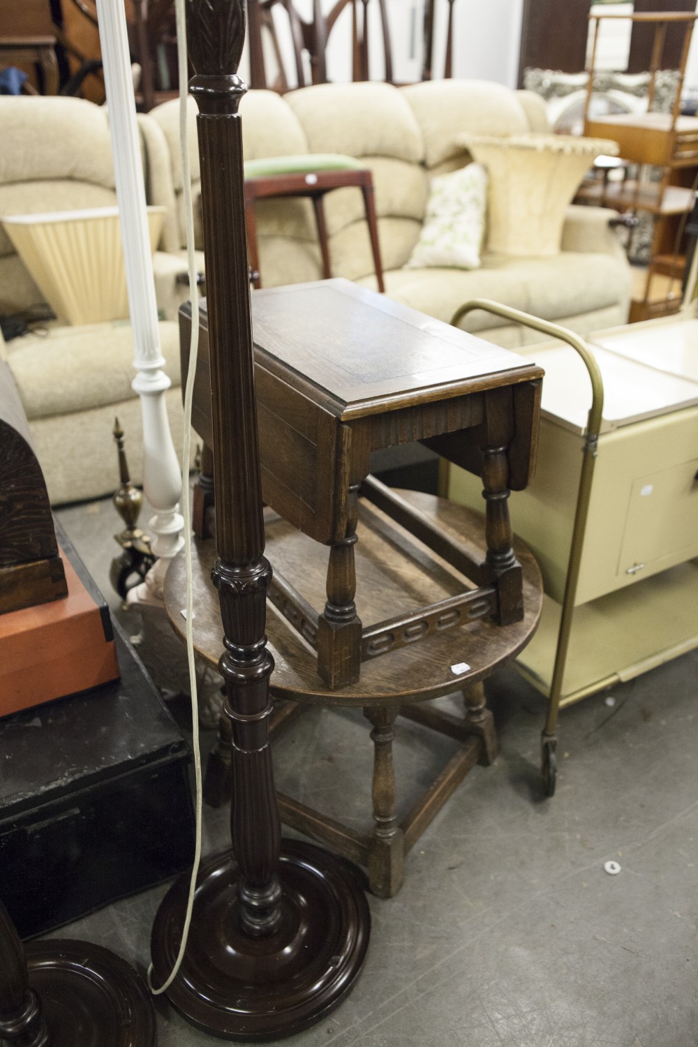 CARVED OAK DROP-LEAF OCCASIONAL TABLE AND AN OAK CIRCULAR OCCASIONAL TABLE, ON TURNED SUPPORTS (2)