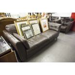 A CHOCOLATE BROWN LEATHER THREE PIECE SUITE, COMPRISING; A FOUR SEATER SOFA AND TWO MATCHING