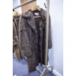 LADY'S BROWN MUSQUASH FULL LENGTH FUR COAT, WITH REVERED COLLAR, DOUBLE BREASTED HOOK FASTENING
