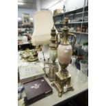 THREE MODERN GILT METAL AND ONYX AND WHITE GLAZED POTTERY ELECTRIC TABLE LAMPS WITH SHADES