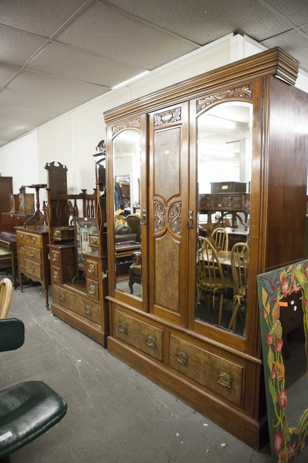A VICTORIAN BEDROOM SUITE OF THREE PIECES VIZ, A TRIPLE WARDROBE WITH MIRRORS TO EACH DOOR, TWO