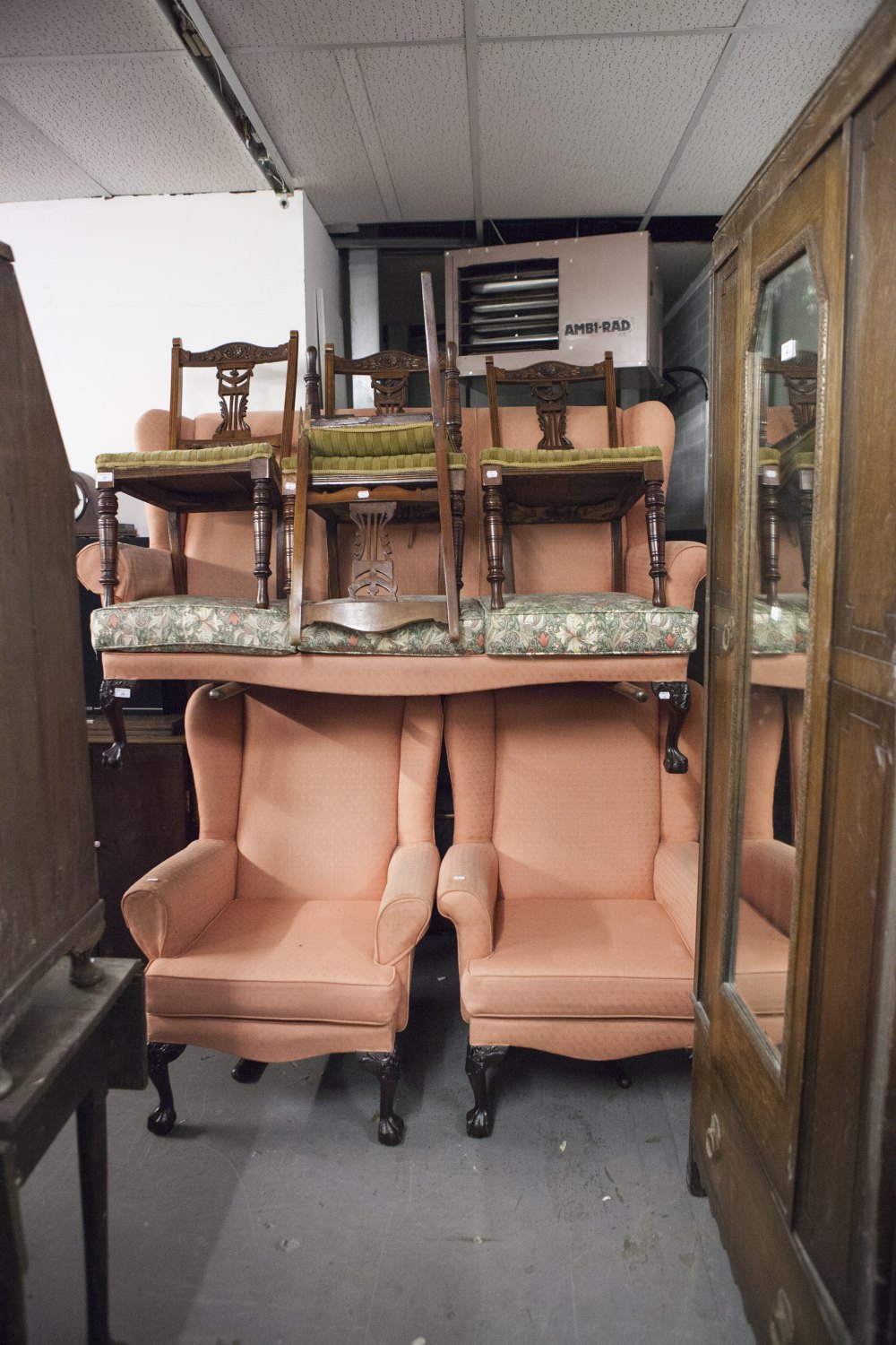 PRE-WAR COTTAGE STYLE WINGED LOUNGE SUITE OF THREE PIECES, RECOVERED IN PINK FABRIC, ON CARVED