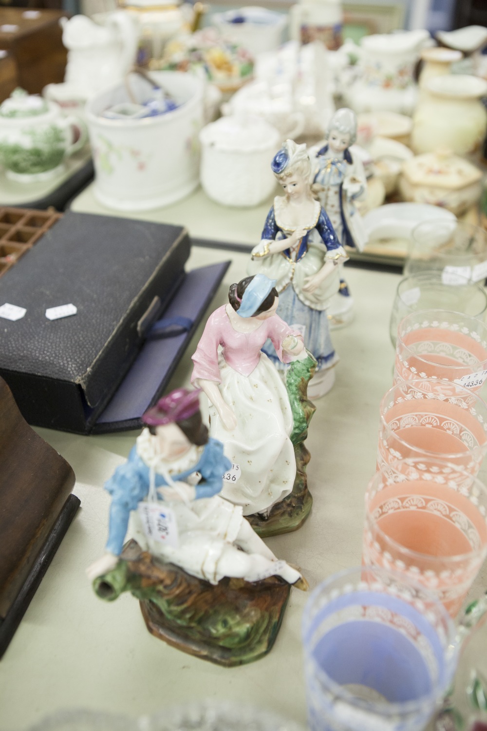 A PAIR OF NINETEENTH CENTURY CONTINENTAL CHINA SEATED FEMALE FIGURES AND A PAIR OF TWENTIETH CENTURY