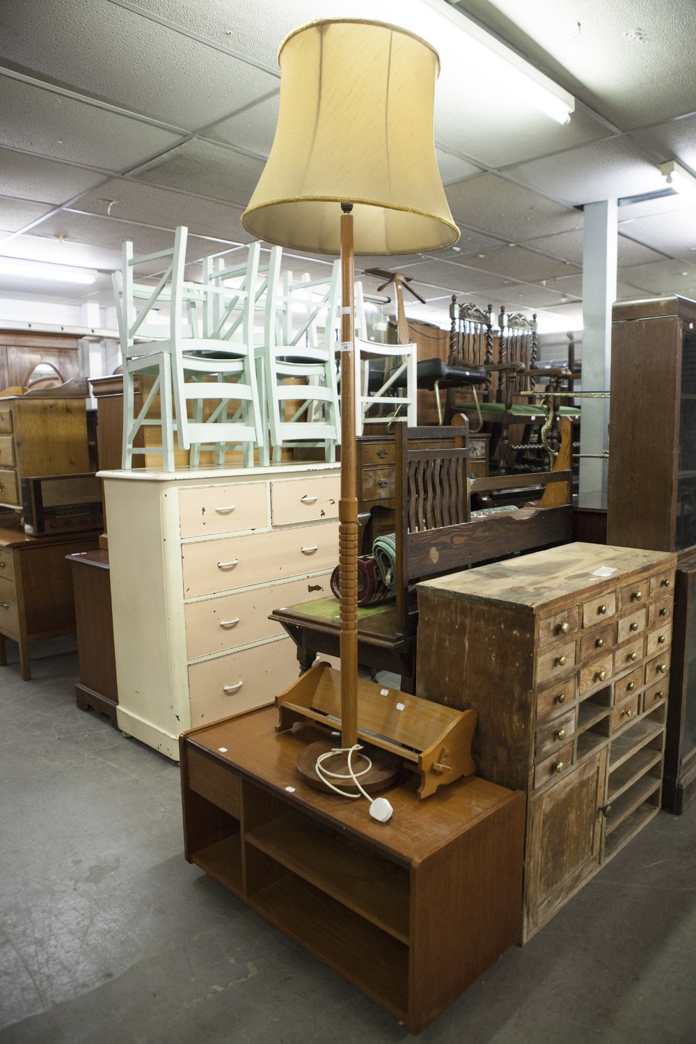 A TEAK STANDARD LAMP AND SHADE, A TEAK LOW STAND WITH SINGLE DRAWER AND OPEN SHELVES AND A SMALL