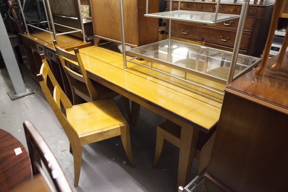 A MODERN BLOND WOOD DINING TABLE AND A SET OF FIVE MATCHING CHAIRS WITH PANEL SEATS