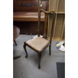 A PAIR OF MAHOGANY REGENCY STYLE CARVERS ARMCHAIRS ON SABRE SHAPED FRONT SUPPORTS AND A QUEEN ANNE