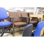 A PAIR OF CIRCA 1920's OAK OPEN ARMCHAIRS WITH RECLINING BACK