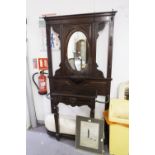 A VICTORIAN MAHOGANY HALL STAND, THE CENTRAL OVAL MIRROR OVAL SHELF, CARVED DECORATION THROUGH-