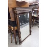 AN EARLY TWENTIETH CENTURY CARVED OAK PIER MIRROR WITH BEVELLED EDGE RECTANGULAR PLATE, FANCY