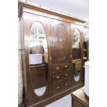 LATE NINETEENTH CENTURY INLAID OAK BEACONSFIELD TYPE WARDROBE WITH TWO OVAL MIRROR PANEL DOORS (A.