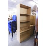 A TWO DIVISION LIGHT FINISH OPEN BOOKCASE OF FOUR TIERS AND A SIMILAR BUT TALLER OPEN BOOKCASE