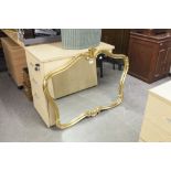 A LARGE GILT FRAMED WALL MIRROR