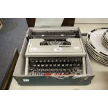 AN OLIVETTI TYPEWRITER IN CASE