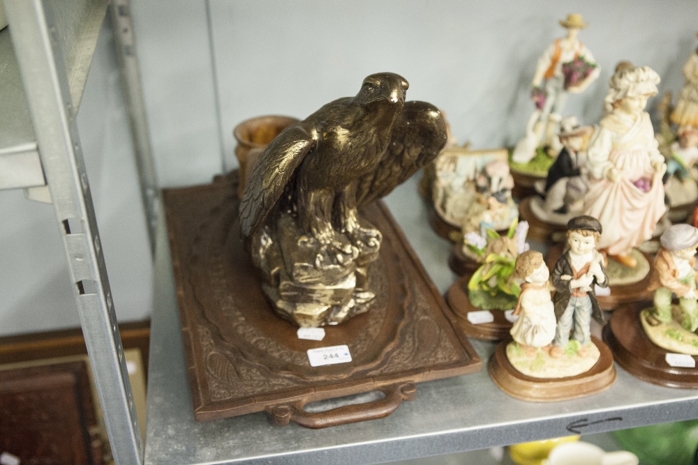 A GILT PLASTER MODEL OF AN HERALDIC EAGLE, AN AUSTRIAN LEAF CARVED AND PIERCE TWO HANDLED OVAL