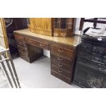 A TWENTIETH CENTURY MAHOGANY DOUBLE PEDESTAL DESK WITH NINE DRAWERS, ON PLINTH BASES, 5;6" X 1'8"