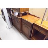 A MAHOGANY SIDEBOARD, WITH THREE DRAWERS, OVER THREE MOULDED PANEL DOORS, THE BRASS DROP HANDLES, ON