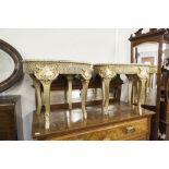 A PAIR OF EMBOSSED AND GILT OVAL COFFEE TABLES, WITH FAUX MARBLE TOPS