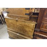 A STAINED PINE CHEST WITH HINGED LIFT UP TOP, METAL END HANDLES, 3' 2" WIDE