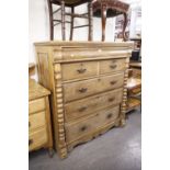 AN EDWARDIAN OAK CHEST, HAVING SECRET DRAWER, TWO SHORT AND THREE LONG GRADUATED DRAWERS