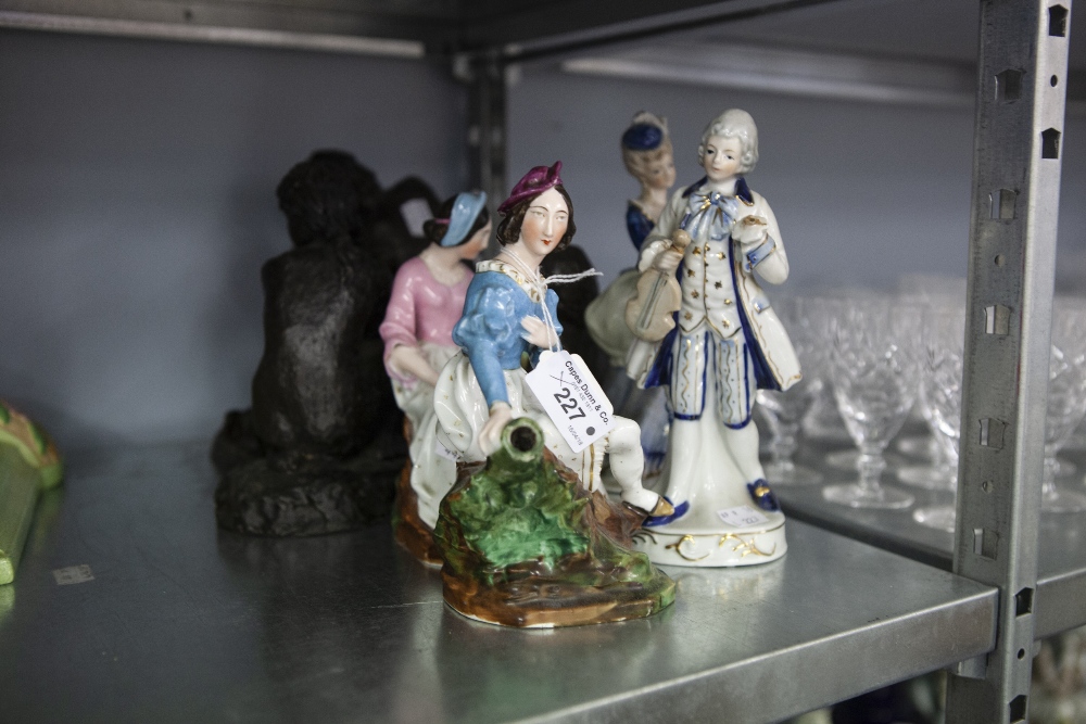 A PAIR OF NINETEENTH CENTURY CONTINENTAL CHINA SEATED FEMALE FIGURES AND A PAIR OF TWENTIETH CENTURY