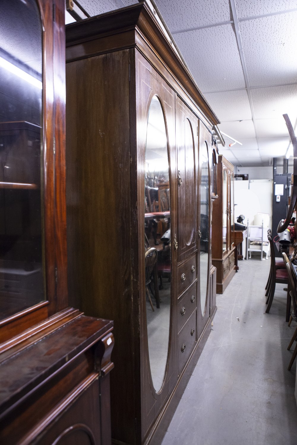 LATE NINETEENTH CENTURY INLAID OAK BEACONSFIELD TYPE WARDROBE WITH TWO OVAL MIRROR PANEL DOORS (A.