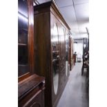 LATE NINETEENTH CENTURY INLAID OAK BEACONSFIELD TYPE WARDROBE WITH TWO OVAL MIRROR PANEL DOORS (A.