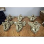 SET OF SIX MODERN MOULDED RECONSTITUTED STONE MODELS OF WINGED GROTESQUES, 16" HIGH, (6)